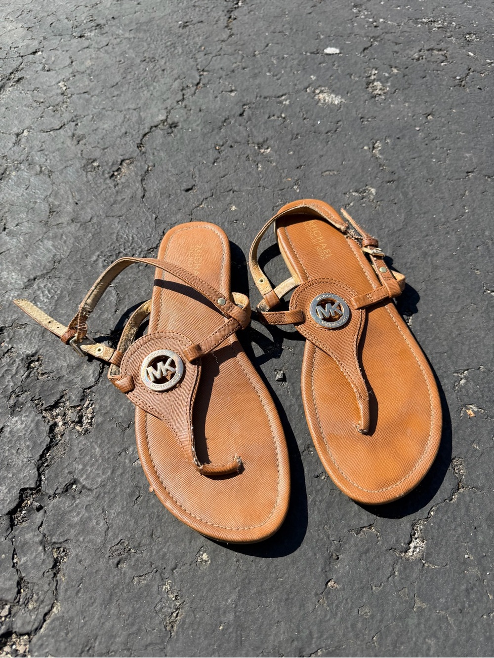 Michael Kors women’s Brown Leather Thong Sandals with MK Medallion